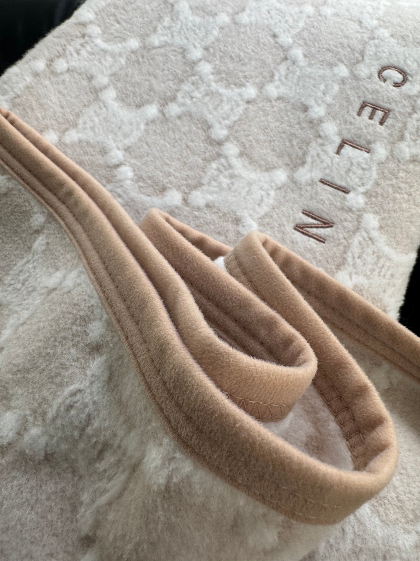 Celine , the Triomphe monogram pattern.