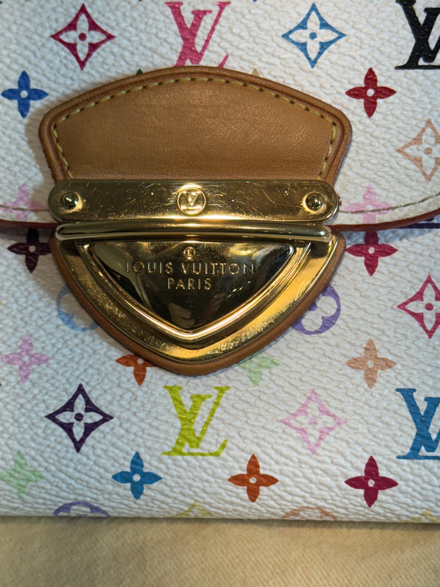 Louis Vuitton white multicolor monogram , the Portefeuille Koala .