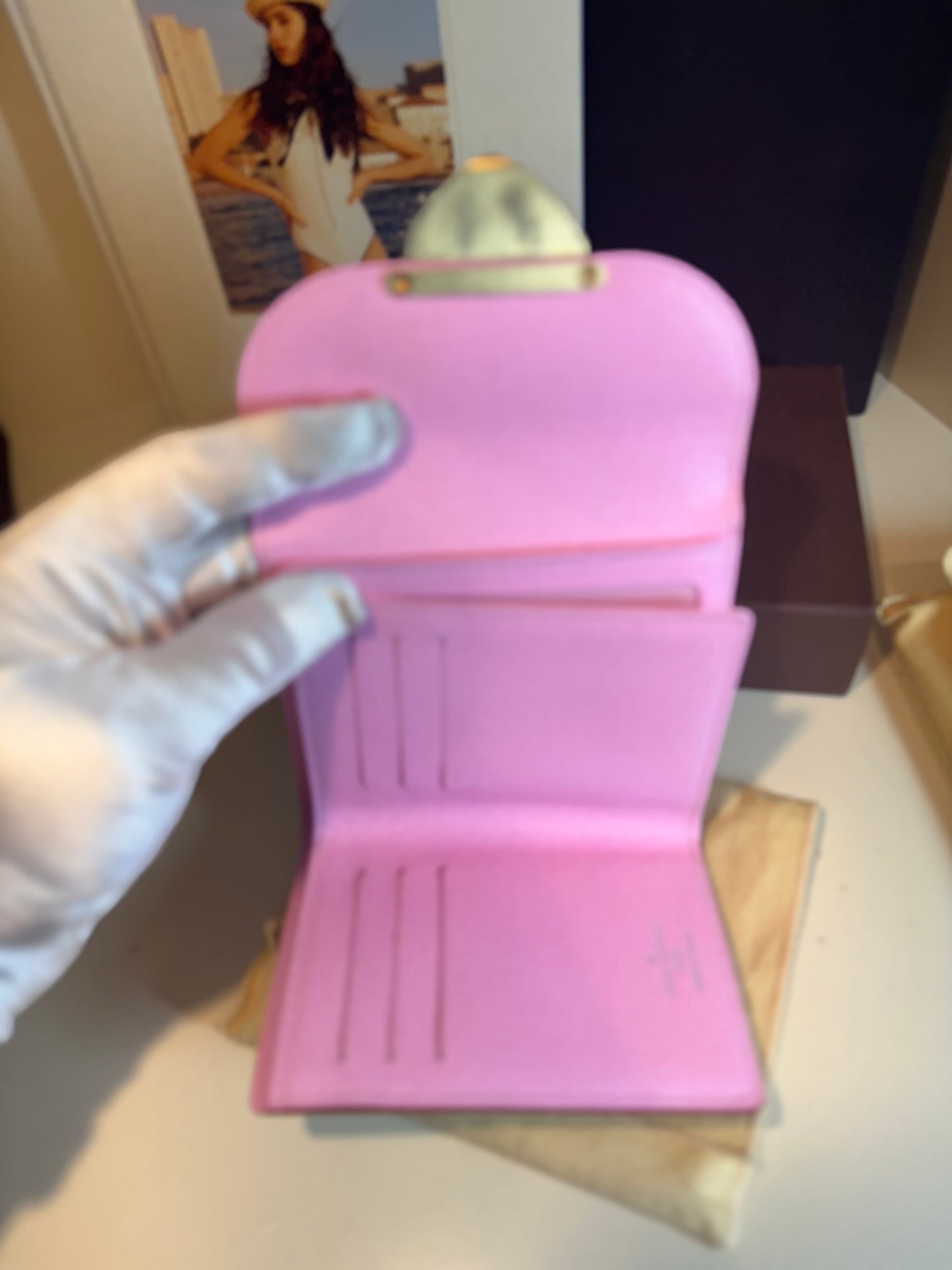 Louis Vuitton white multicolor monogram , the Portefeuille Koala .