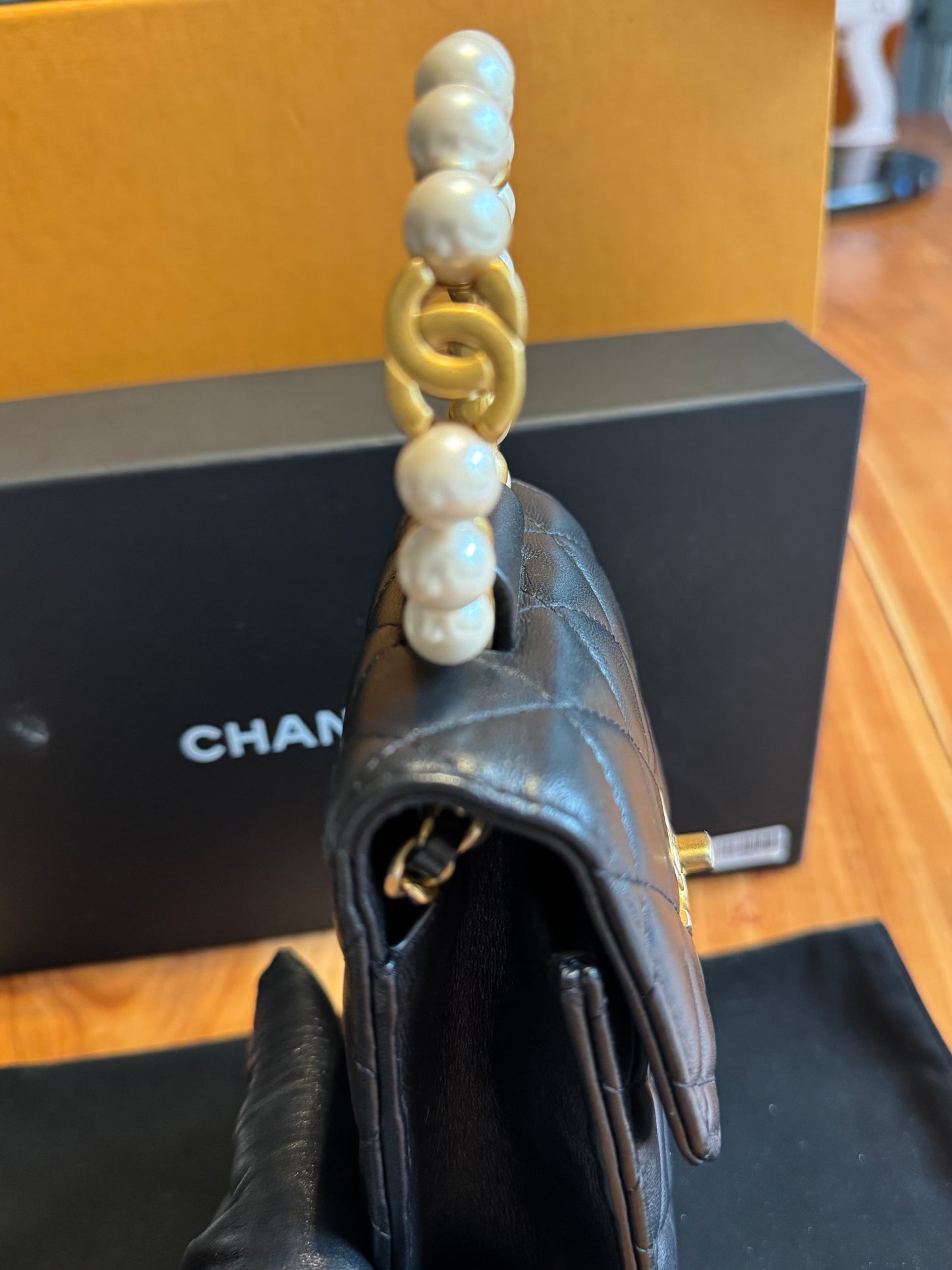 Chanel Pearl-Handle Quilted Phone Holder – Black Lambskin & Gold Hardware – Entrupy Verified