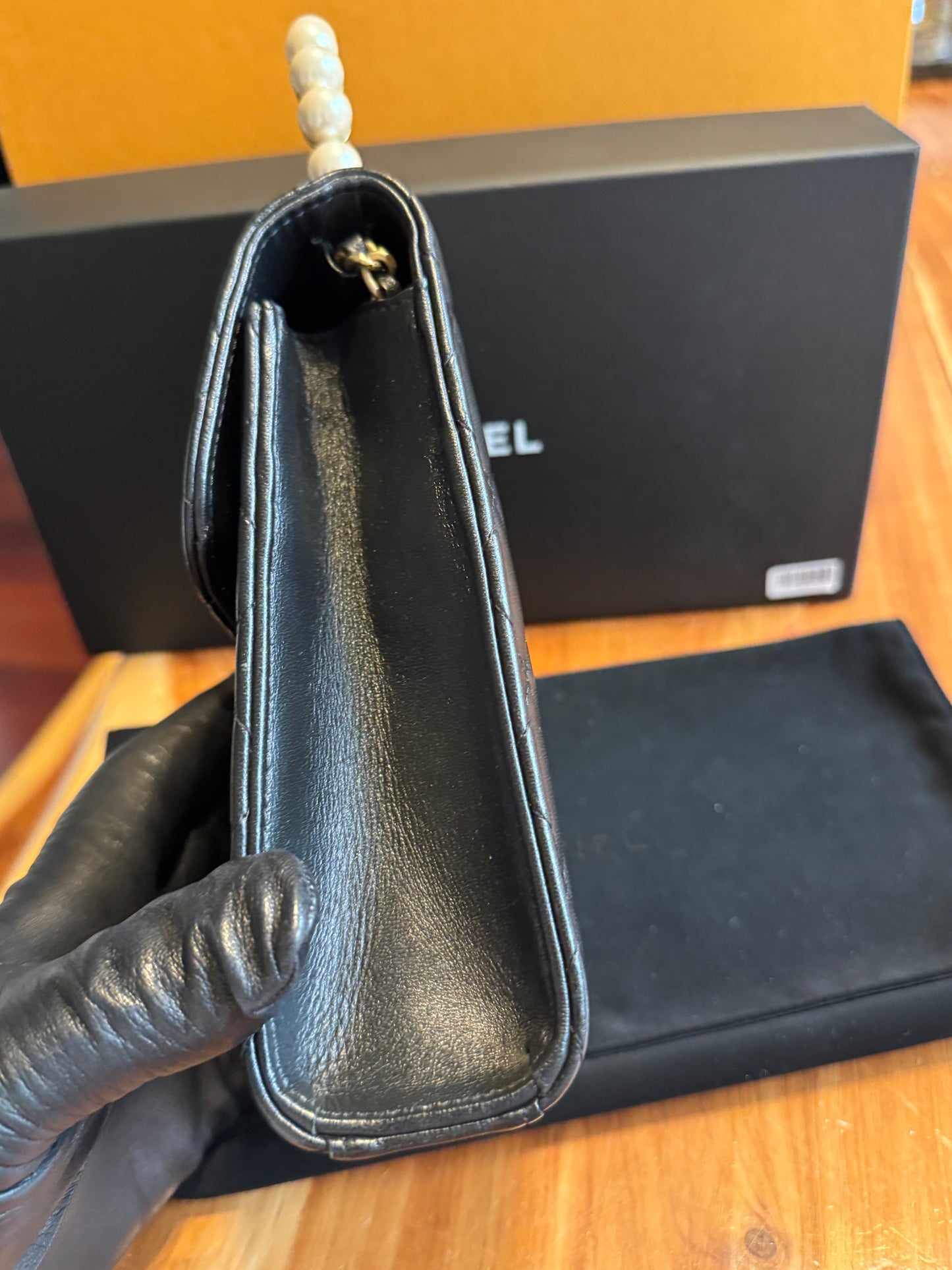 Chanel Pearl-Handle Quilted Phone Holder – Black Lambskin & Gold Hardware – Entrupy Verified