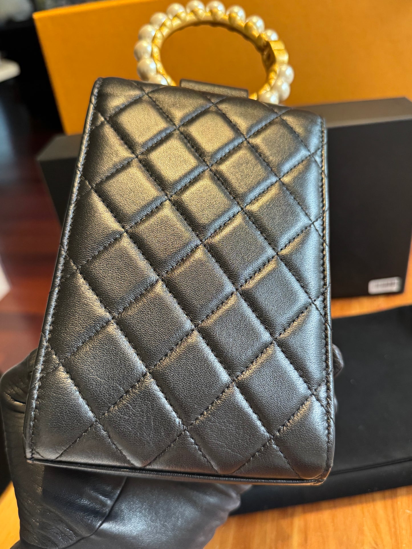 Chanel Pearl-Handle Quilted Phone Holder – Black Lambskin & Gold Hardware – Entrupy Verified