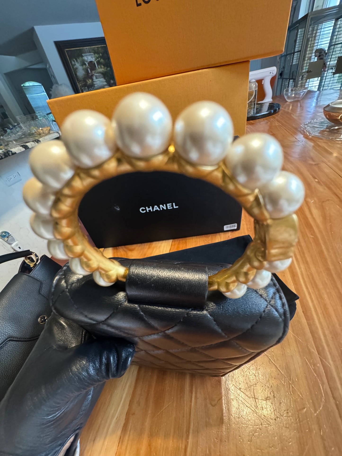 Chanel Pearl-Handle Quilted Phone Holder – Black Lambskin & Gold Hardware – Entrupy Verified
