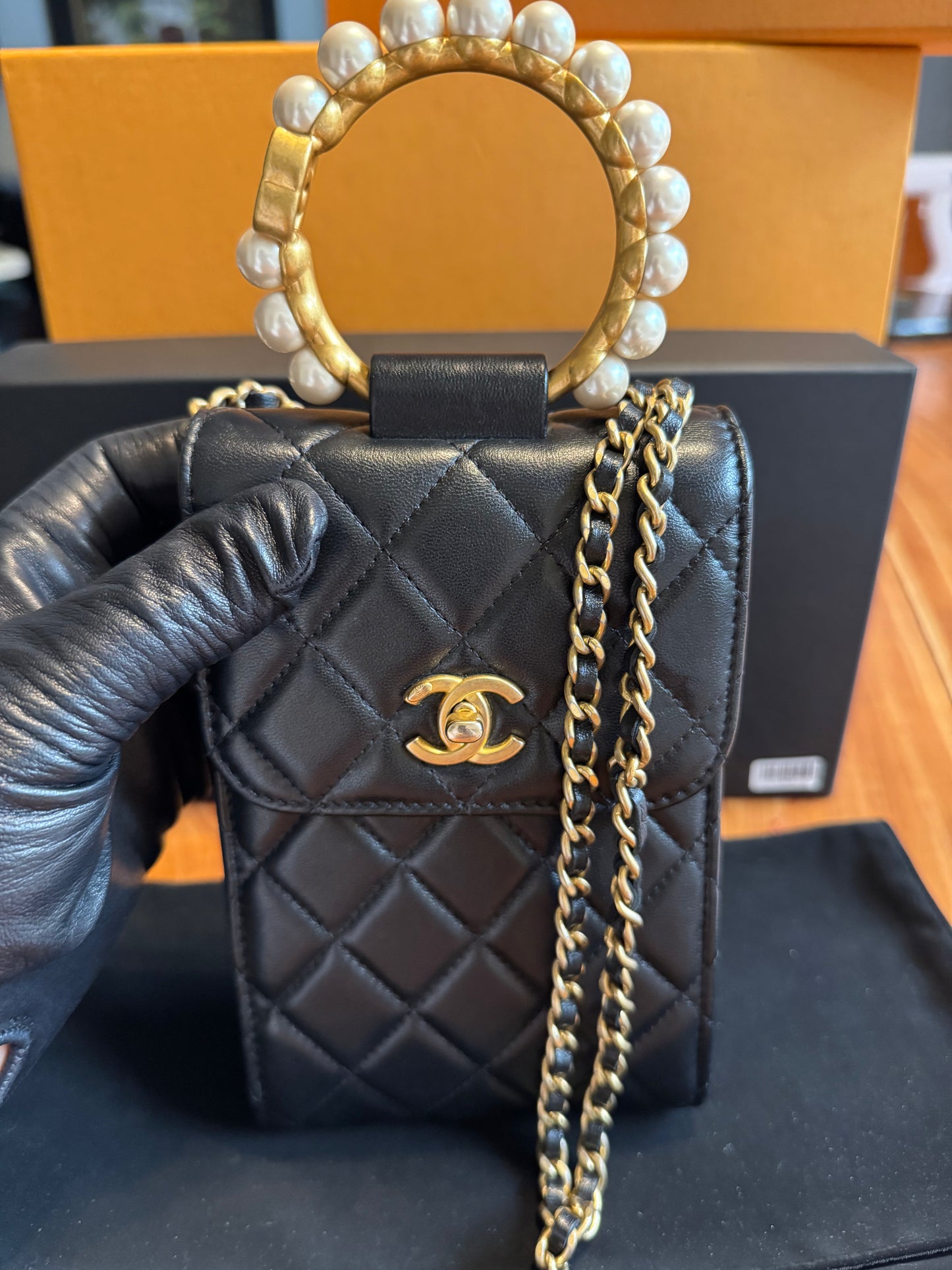 Chanel Pearl-Handle Quilted Phone Holder – Black Lambskin & Gold Hardware – Entrupy Verified